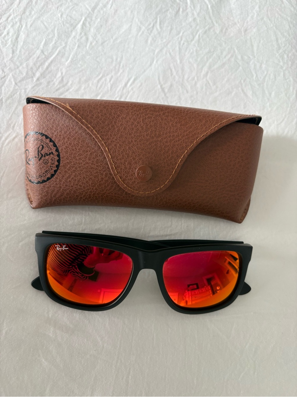 Ray-Ban Black Frame Sunglasses with Red-Orange Mirrored Lenses